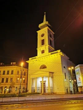 A clock tower in front of a building Stock Photos