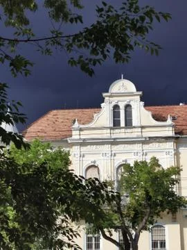 A clock tower in front of a building Stock Photos