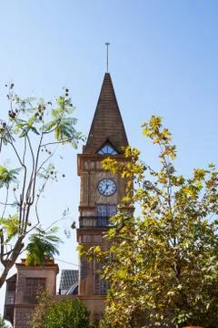 A clock tower in front of a building Foto stock