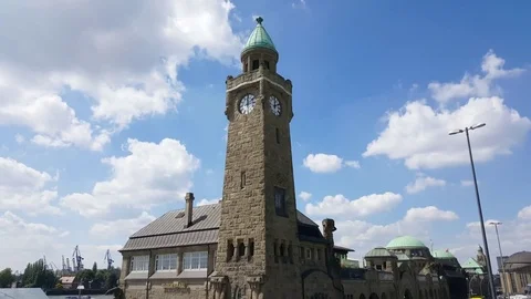 Clock tower, Hamburg cityscape, cranes in distance, sunny day, Germany Видео 76058204
