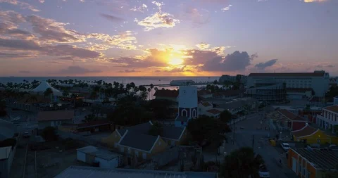 Clock-tower island empty streets  flyover beauty full sunset Aruba, Caribbean. Stock-Footage 128609304