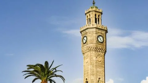 Clock tower in izmir. Beautiful clouds crossing the sky. Stock Photos