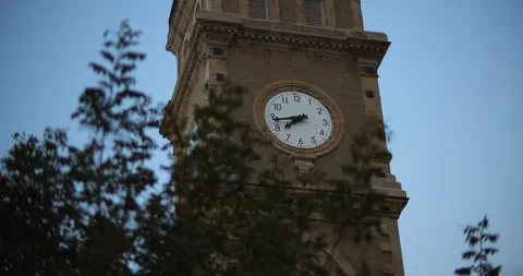Clock tower of the muslim mosque minaret with blue sky in the background Stock Footage 123685613