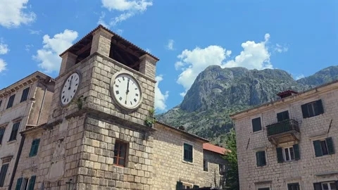 Clock Tower in Old Town Kotor with mountain in the background Stock Footage 344088397