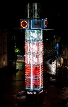 Clock tower in Oslo called Trafikanten with neon lights at night Stock Photos