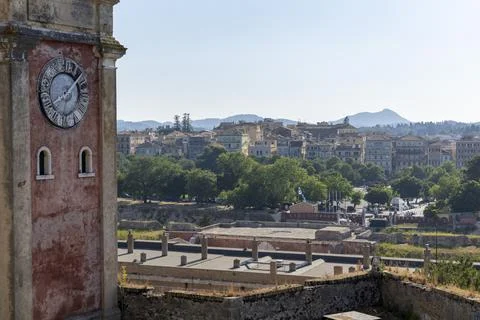 Clock tower over Corfu town cityscape in Greece Stock Photos