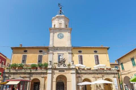The Clock Tower in Piazza Eroe dei due mondi square, Orbetello, Grosseto, Italy Stock Photos