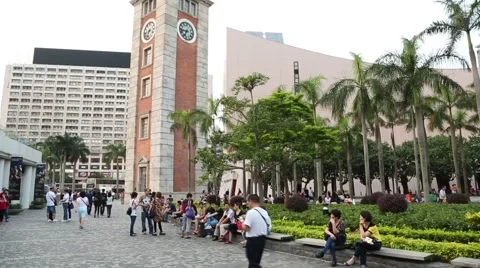Clock Tower on the quay Kowloon Peninsula and vacationers people, Hong Kong Stock Footage 50229045