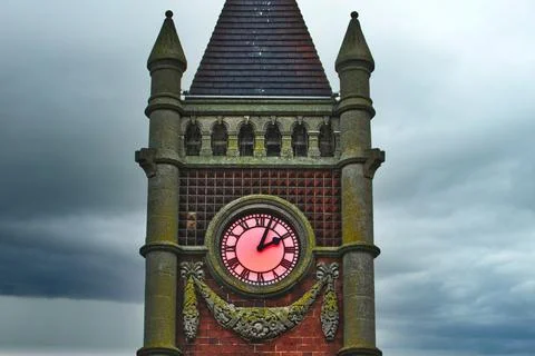 Clock Tower Section with Pink Clock Face in Redcar, UK. Stock Photos