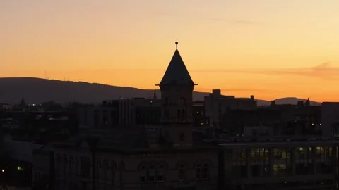 Clock Tower Silhouette Against Vibrant Dublin Sunset 스톡 동영상 332815616