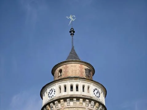 Clock tower skyward. Circular clock faces under clear sky with shining weat.. Stock Photos