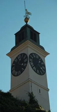 Clock tower with small bell tower at top in Novi Sad, Serbia Stock Photos