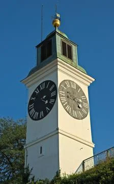 Clock tower with small bell tower at top in Novi Sad, Serbia Stock Photos