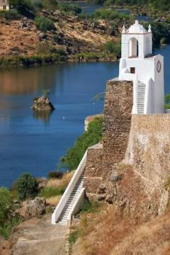 Clock tower (Torre do Relogio) on the right bank of Guadiana. Mertola. Portug Fotos Stock