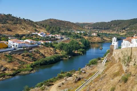 Clock tower (Torre do Relogio) on the right bank of Guadiana. Mertola. Portug Fotos Stock