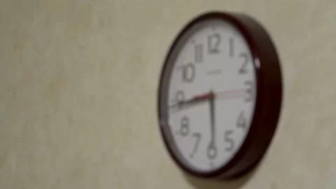 The clock on the wall is blurry 4K Stock Footage 168880633