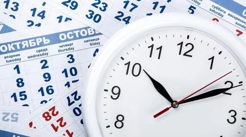 Clock with wall calendar sheets with the number of days Stock Photos