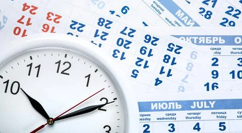 Clock with wall calendar sheets with the number of days Stock Photos