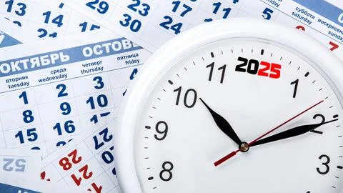 Clock with wall calendar sheets with the number of days Stock Photos