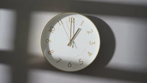The clock on the wall showed 1:00. Stock Footage 162655730