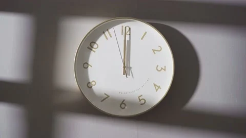 The clock on the wall showed 12:00. Stock Footage 162657065