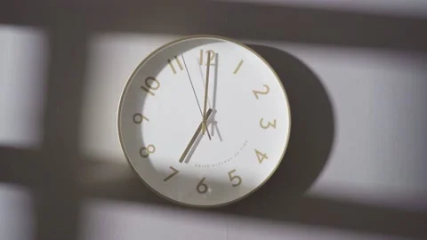 The clock on the wall showed 7:00. Stock Footage 162656572