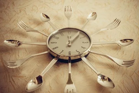 The clock on the wall, twelve o'clock. Stock Photos