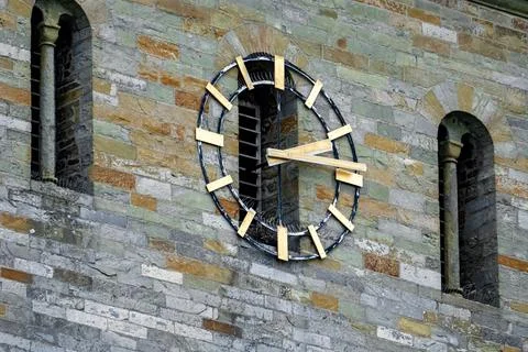 A clock on a wall with a wooden frame Stock Photos