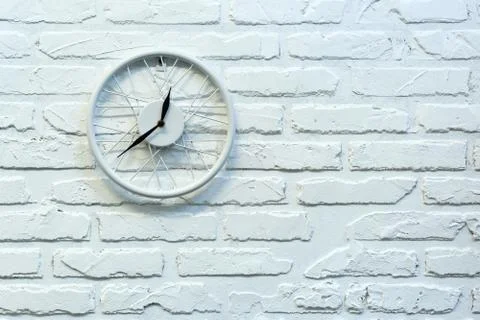 Clock in white brick wall. Background. Texture. Brick. Stock Photos