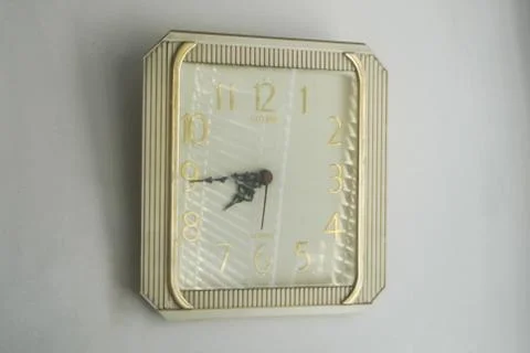 Clock on a white wall Stock Photos