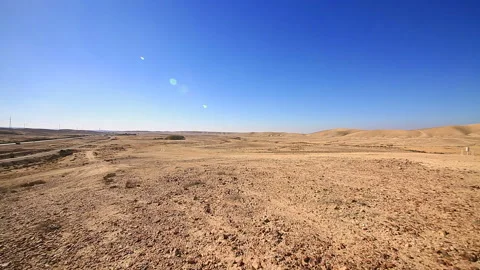 Clockcounterwise panoramic of road traffic over desert Stock Footage 96450464