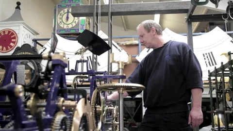 Clockmaker Testing Large Mechanical Clock Mechanism in Workshop Stock Footage 345753439