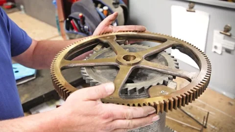 Clockmaker Testing Ratchet and Click Mechanism on Large Tower Clock Gear Stock Footage 345750724