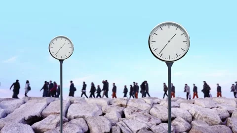 Clocks against crowd of people walking along rocky pier Stock Footage 143807775