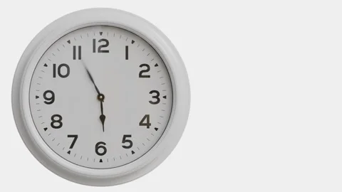 Clocks display time on white wall in simple round shape Stock Footage 321008936