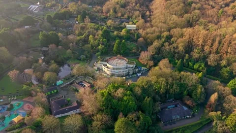 Clockwise 4K 60FPS aerial view of the Floral Hall at Belfast Zoo in North Stock Footage 325846159
