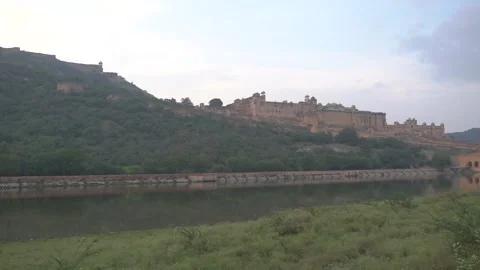 Clockwise Gimbal Roll Shot of Amer Fort from Lakeside View, Jaipur, India Stock Footage 312947408