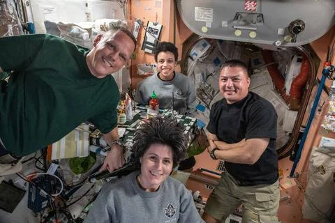 (Clockwise from left) Expedition 67 Flight Engineers Bob Hines, Jessica Wa... Stock Photos