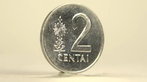 Clockwise Rotating Round Smooth Shiny Silver Two Cent Foreign Coin 写真素材