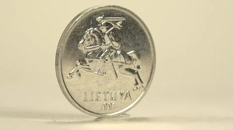 Clockwise Rotating Round Smooth Shiny Silver Two Cent Foreign Coin Stock Photos