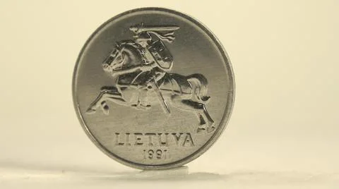 Clockwise Rotating Round Smooth Shiny Silver Two Cent Foreign Coin Stock Photos