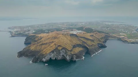 Clockwise S/E Aerial View of Udo Island with Soemeori Oreum in front, Jeju Stock Footage 146067382