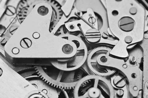 Clockwork, black-and-white gears in an watch. Teamwork concept, idea Stock Photos
