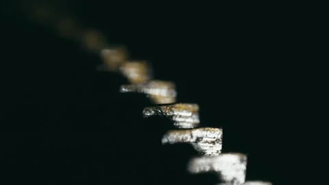 Clockwork cog teeth rhythmic clicking motion, isolated MACRO focus Stock Footage 314654147