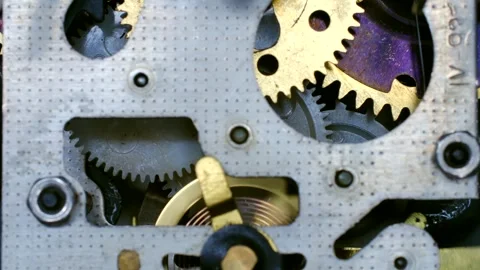 Clockwork gears rotating smoothly in mechanical device Stock Footage 310521357