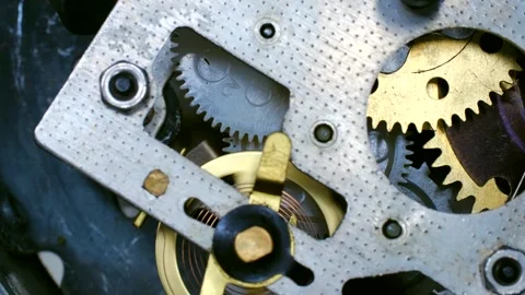 Clockwork gears rotating smoothly in perfect synchronization Stock Footage 310521100