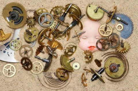 Clockwork mechanism on the sand Stock Photos