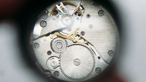 Clockwork mechanism under magnifier Stock Footage 86614785