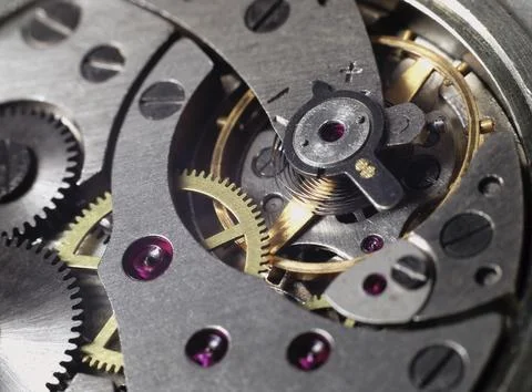 Clockwork of the metallic mechanical watch close-up Stock Photos