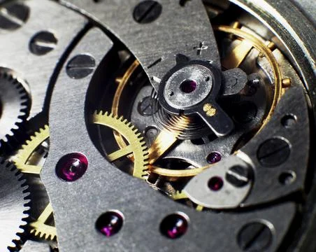 Clockwork of the metallic mechanical watch close-up Stock Photos